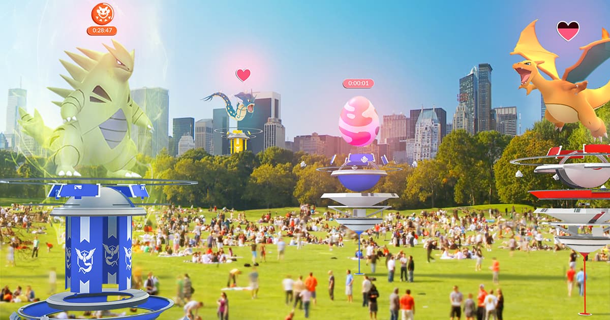 Pokemon GO Raids as they were announced with lots of people at a park